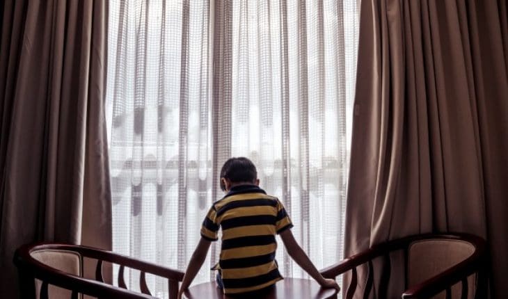 boy sitting table looking down down 1353 86 | GFC