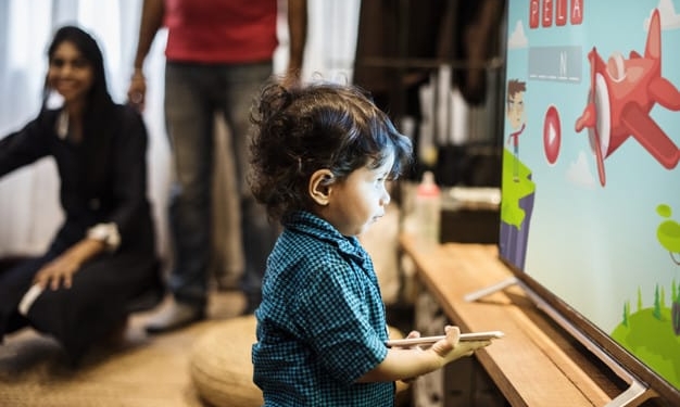 young indian boy watching television 53876 30540