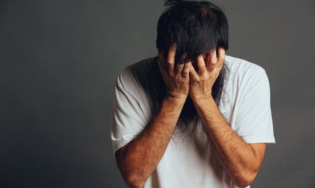 man stress out cover his face by his hands 1150 27287